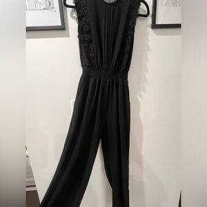 Black jumpsuit with open back cutout